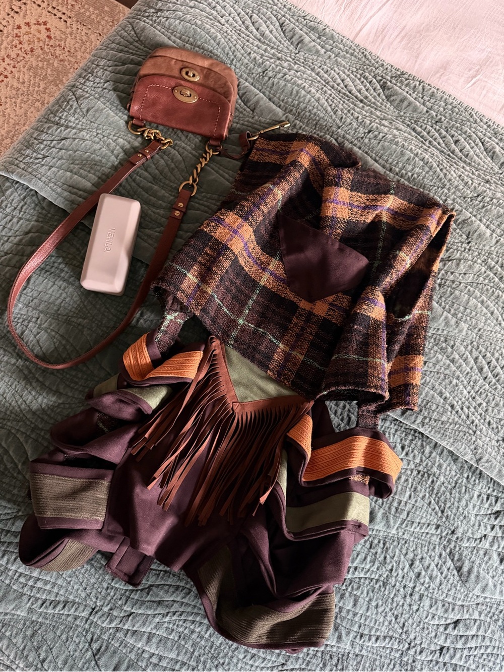 The Louqii Exceptional Quality Nomad Vest with Plaid Fringe and cutout design